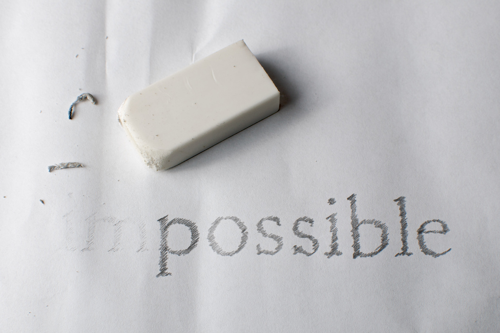 The word impossible with an earser rubbing out im to make the word possible. Image by Niklas Morberg