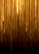 an abstract image - gold lines shooting down on a black background
