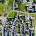 Aerial drone view of small winding streets and roads in a residential area of a small town