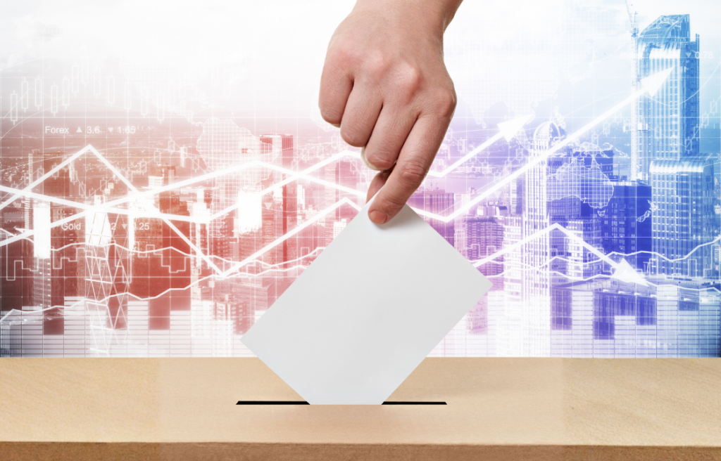 A hand posting a vote into a ballot box