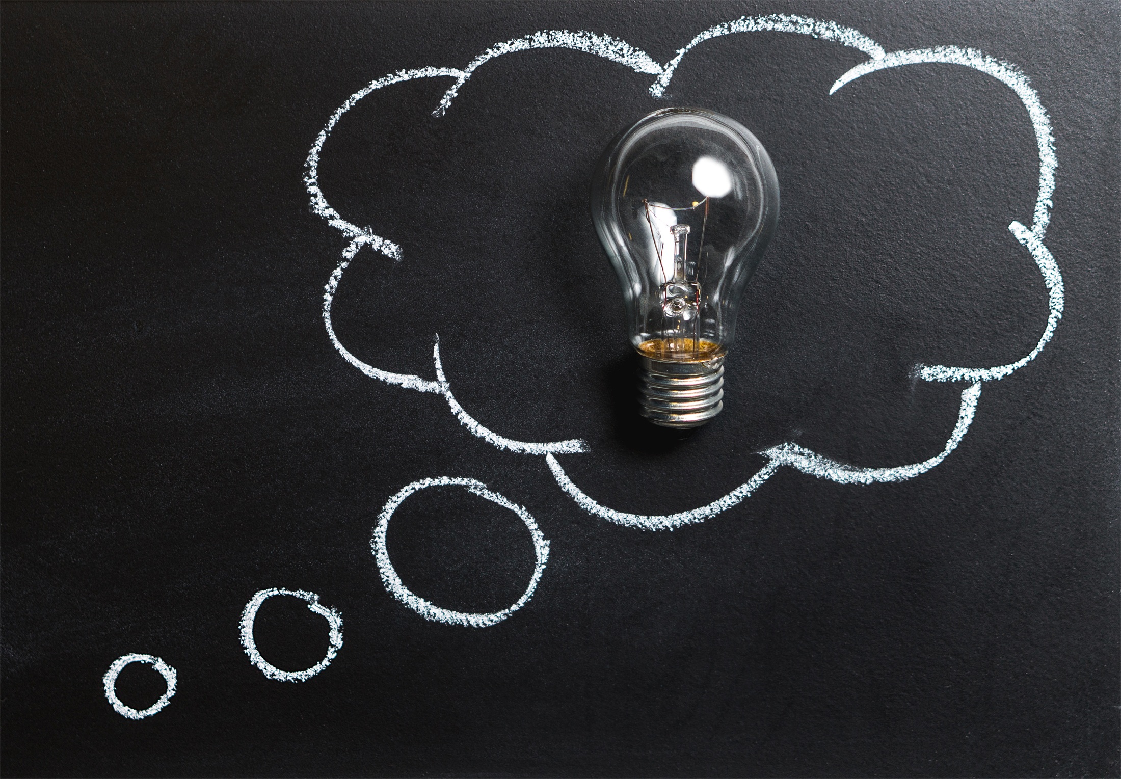 Lightbulb inside a thought bubble