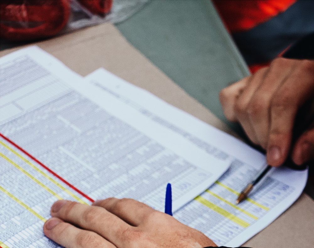 A person looking at data on paper