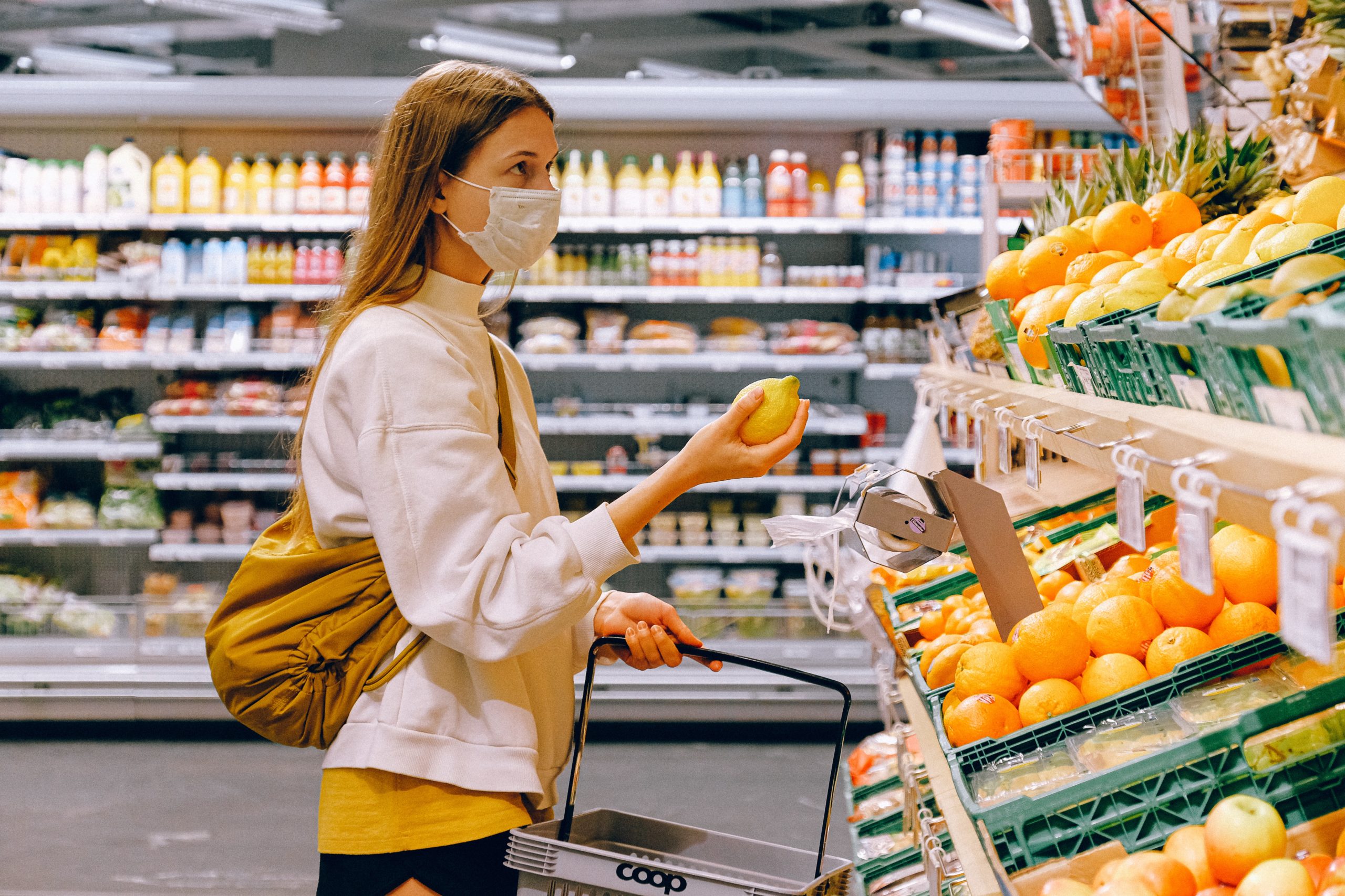 A woman shopping with a face mask on