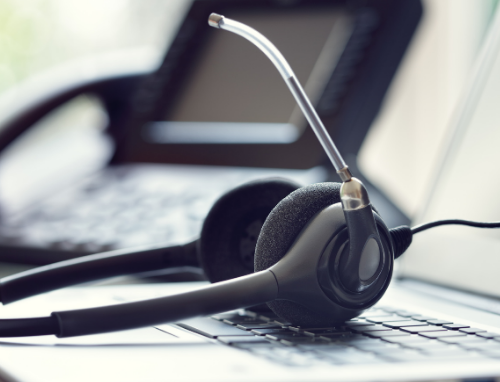 A headset resting on a laptop key board