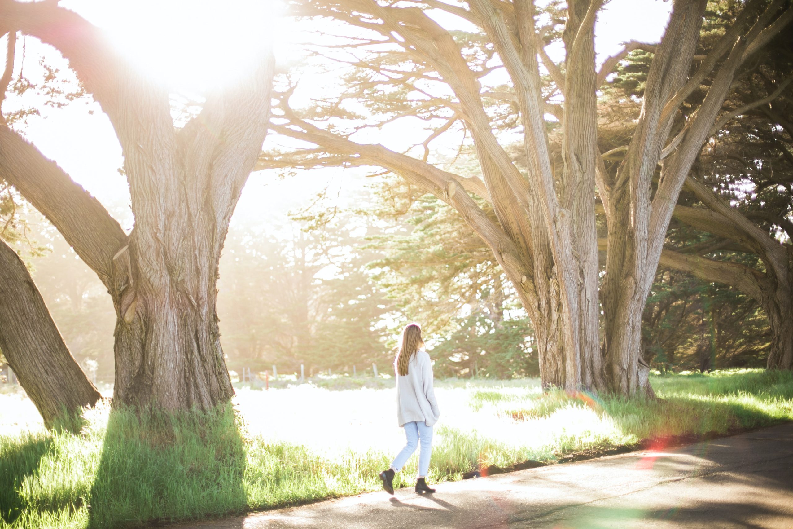 A girl walking alone in a park