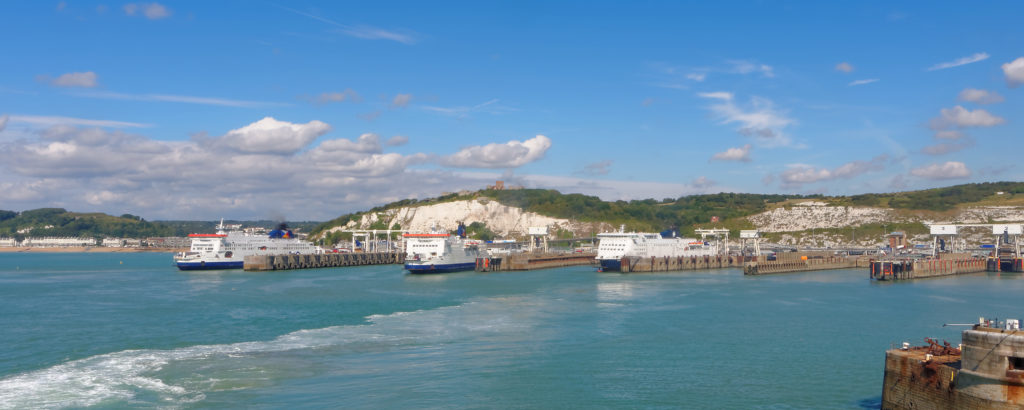 Three ferries at the port of Dover on a sunny day.