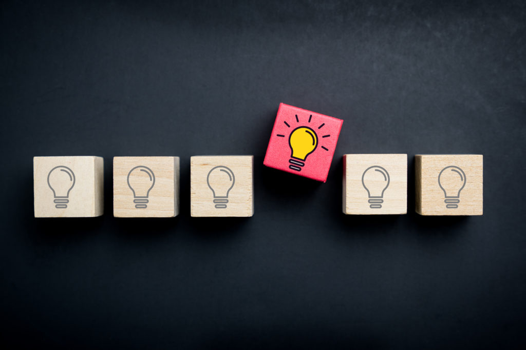 Innovation, creative or new idea concept using wood blocks with lightbulb