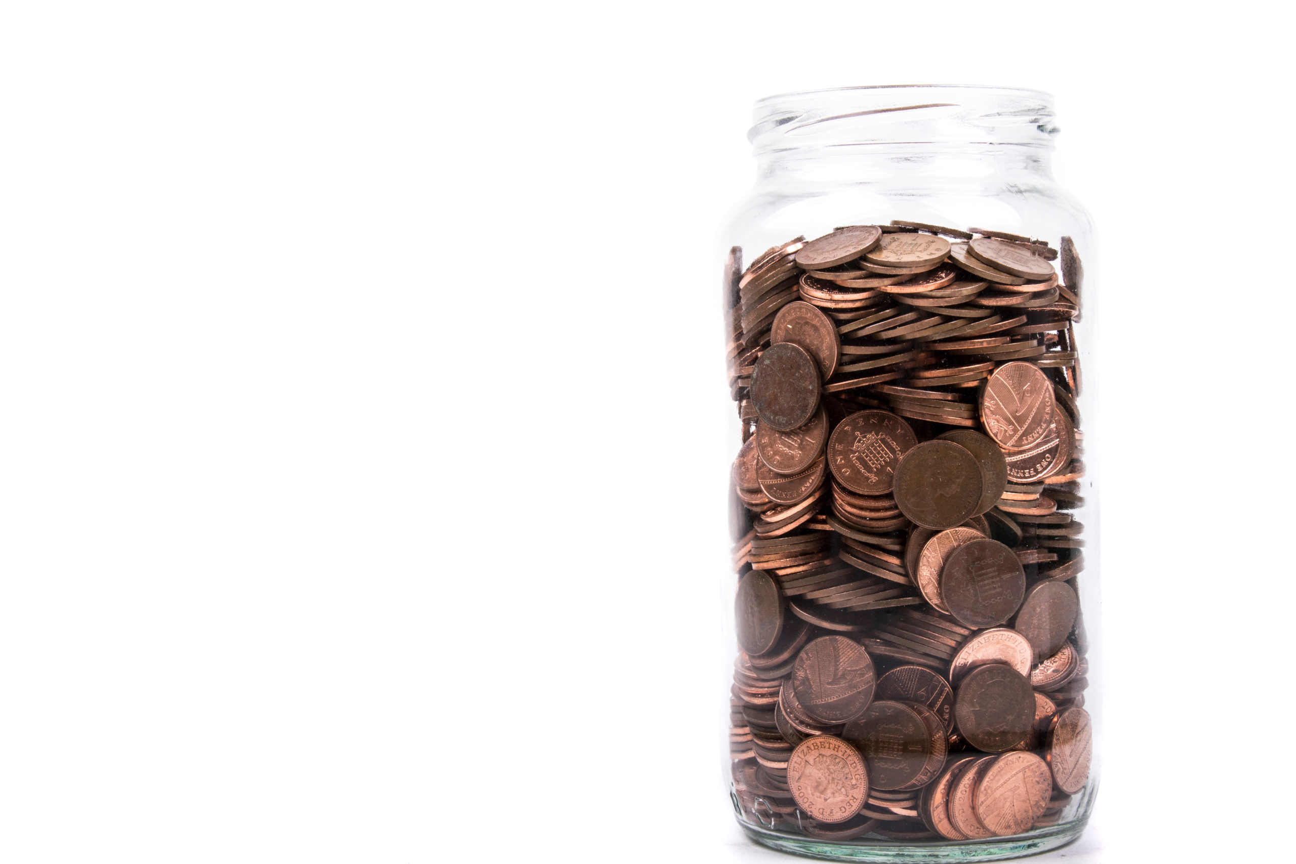 A change jar filled with pennies