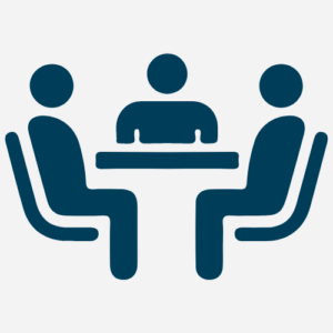 people_sitting_around_desk_blue