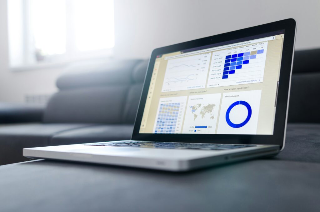 a laptop with statistics and data showing on screen