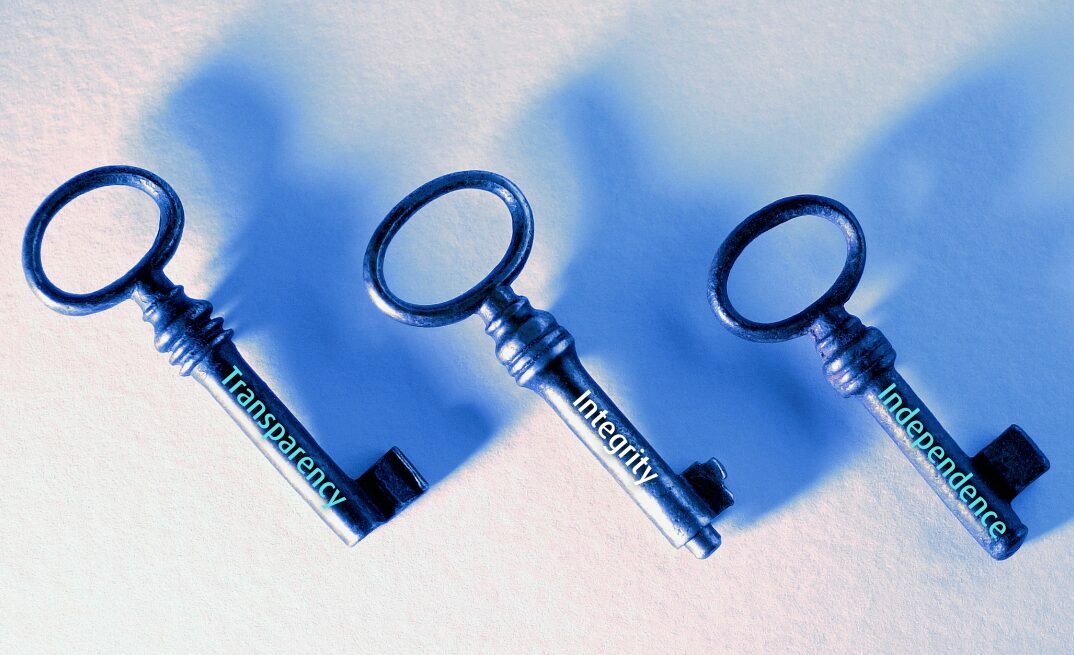 three keys with the words transparency, integrity and independence written on them