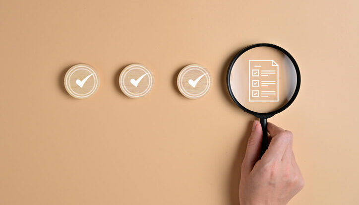 Decorative image of a magnifying glass and icons