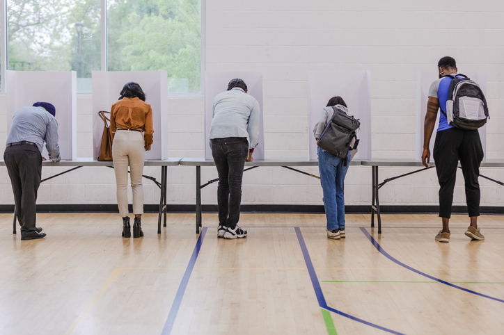 Decorative image. People at polling station